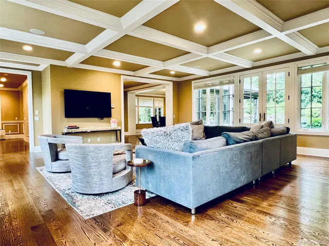 a living room with fireplace furniture and a flat screen tv