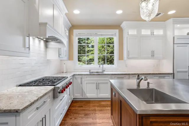 a kitchen that has a sink and a stove