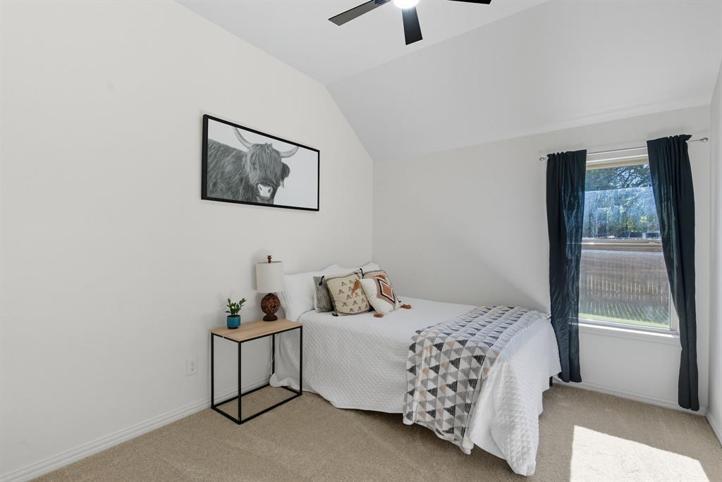 104 Candis Court Springtown, TX 76082 - Photo 24 of 40 a bedroom with a bed and a window