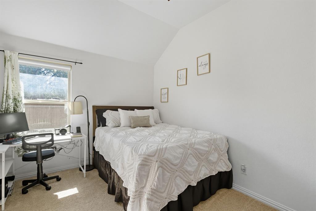 104 Candis Court Springtown, TX 76082 - Photo 25 of 40 a bedroom with a bed chair and window