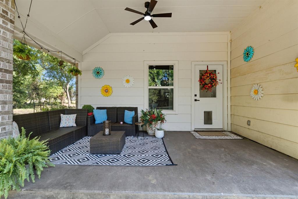 104 Candis Court Springtown, TX 76082 - Photo 26 of 40 a building outdoor space with patio furniture and potted plants