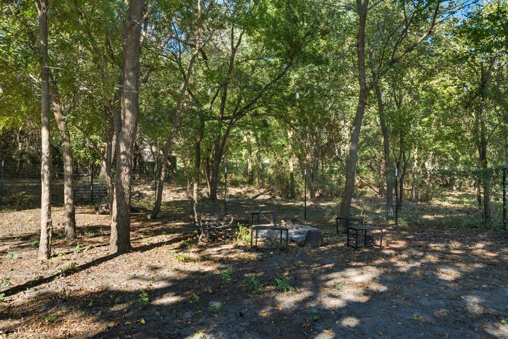 104 Candis Court Springtown, TX 76082 - Photo 31 of 40 a view of outdoor space with deck and trees