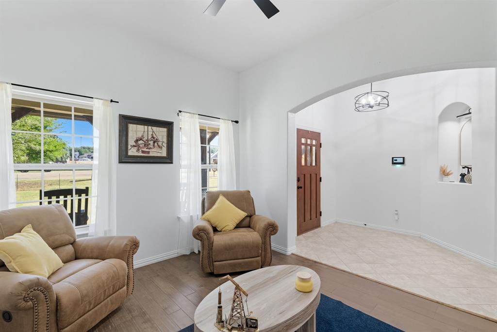 104 Candis Court Springtown, TX 76082 - Photo 6 of 40 a living room with furniture and a window