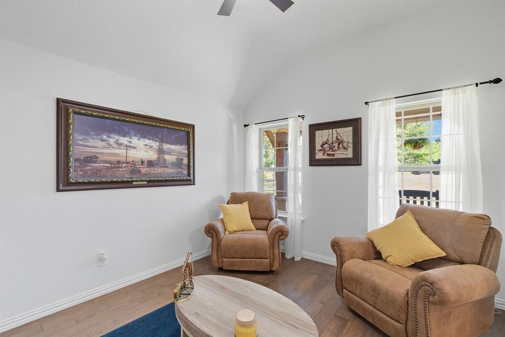 104 Candis Court Springtown, TX 76082 - Photo 7 of 40 a living room with furniture and a window