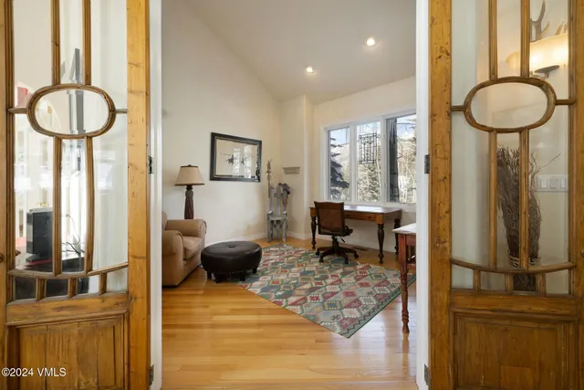 a spacious bedroom with a bed and a cabinets