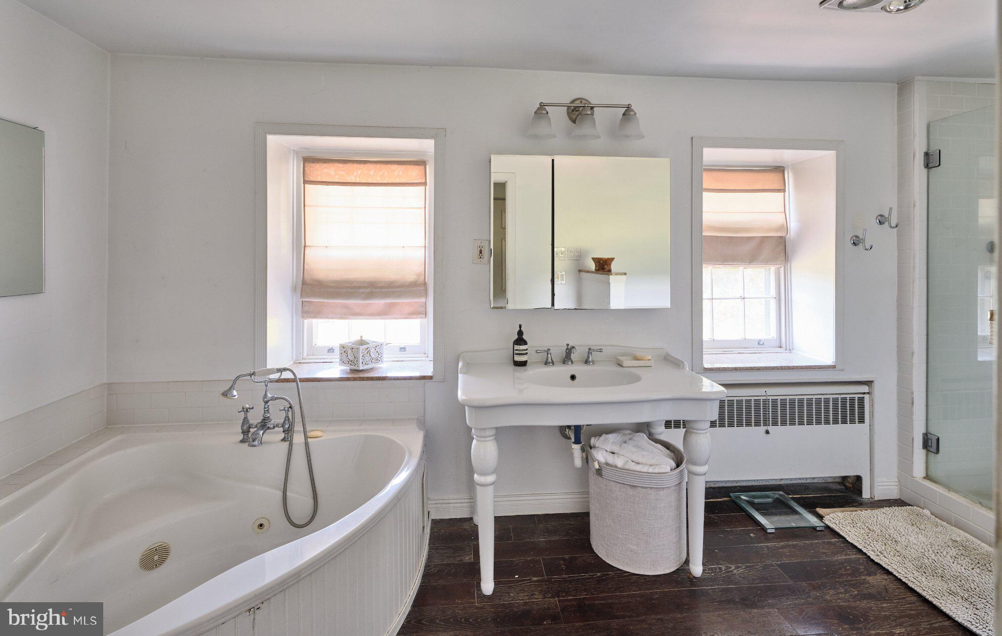 765 Swamp Road Newtown, PA 18940 - Photo 17 of 37 a bathroom with a bathtub sink and toilet