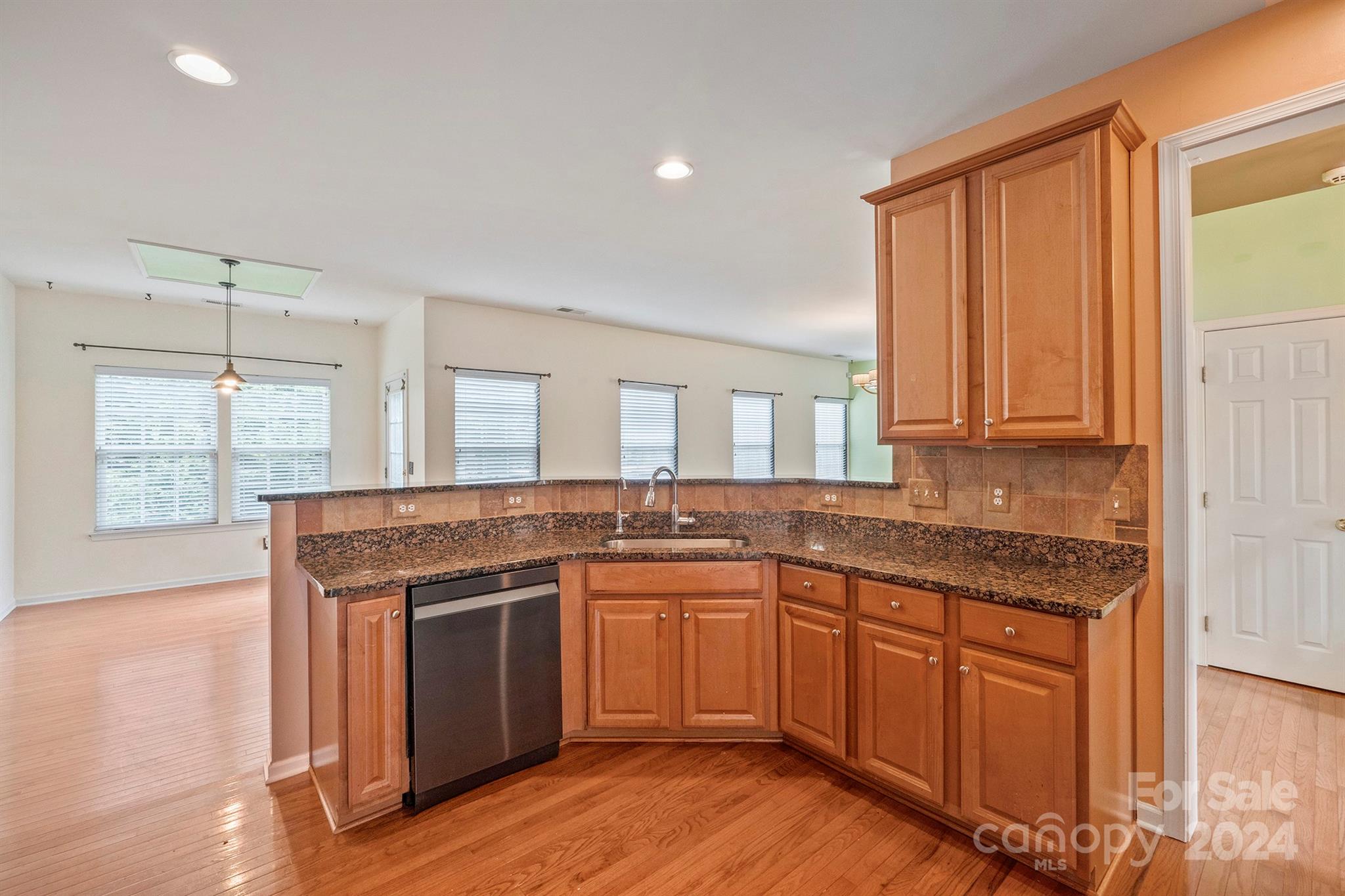 1969 Faison Avenue Fort Mill, SC 29708 - Photo 8 of 37 a kitchen with stainless steel appliances granite countertop wooden cabinets a sink and a stove