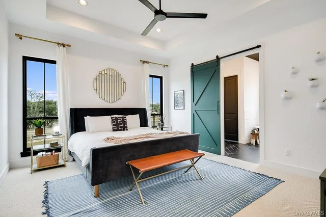 a bedroom with a bed and a table in it