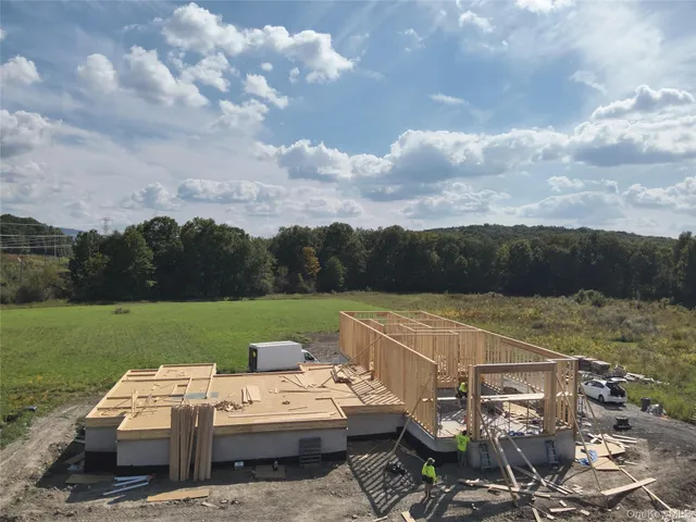 a view of a house with pool table and chairs