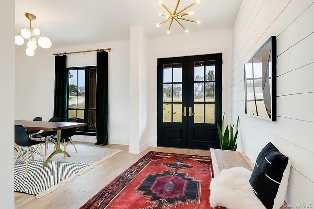 a bedroom with a bed dresser and a window