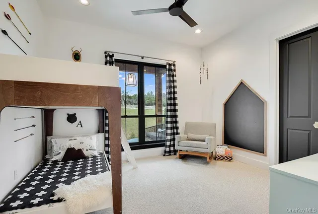 a bedroom with furniture and window