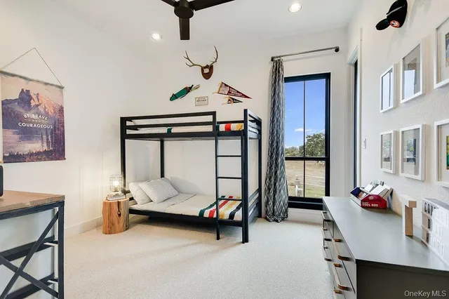 a bedroom with furniture and a chandelier