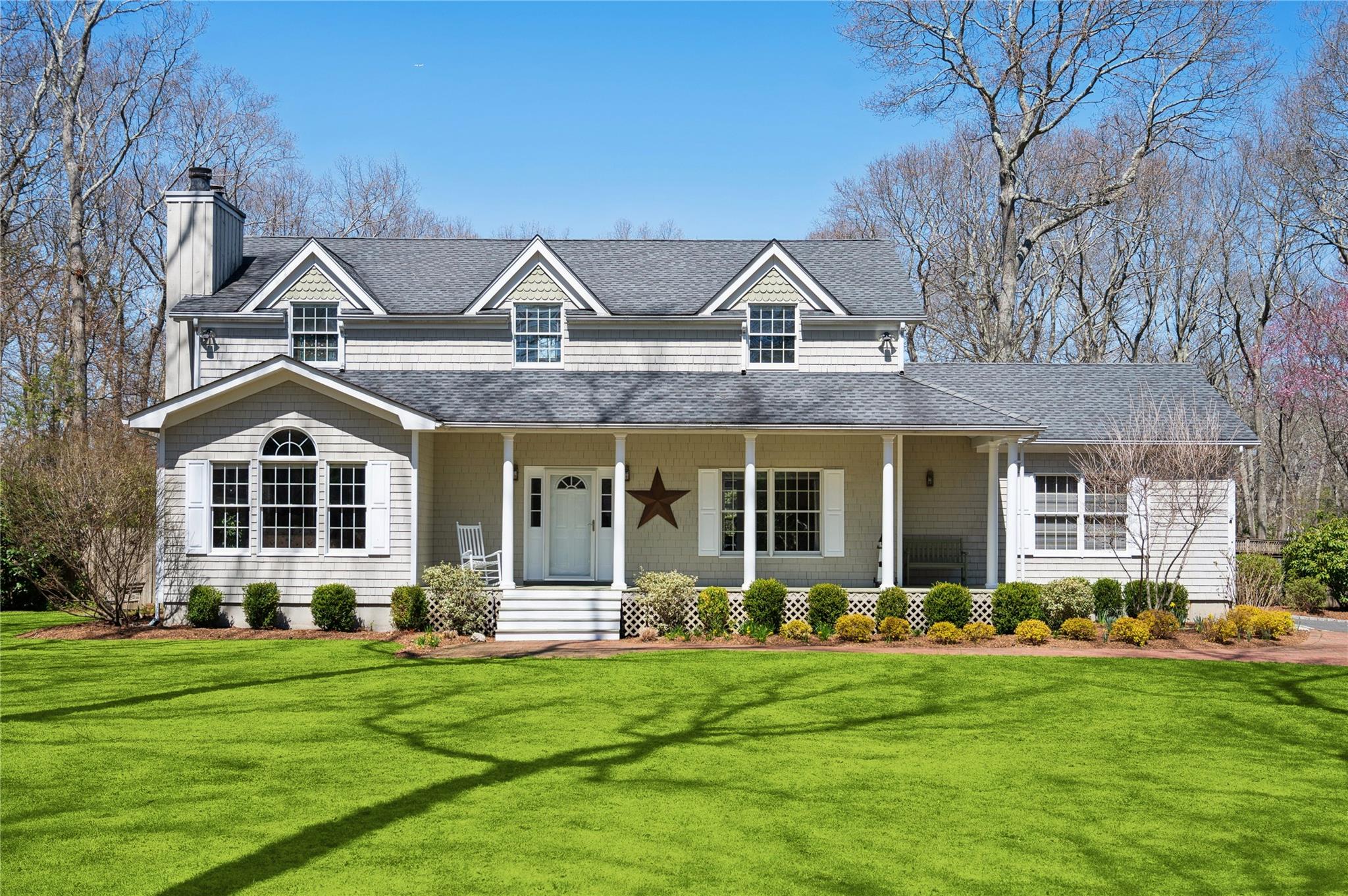 86 Inlet View Path East Moriches, NY 11940 - Photo 1 of 1 a front view of a house with garden