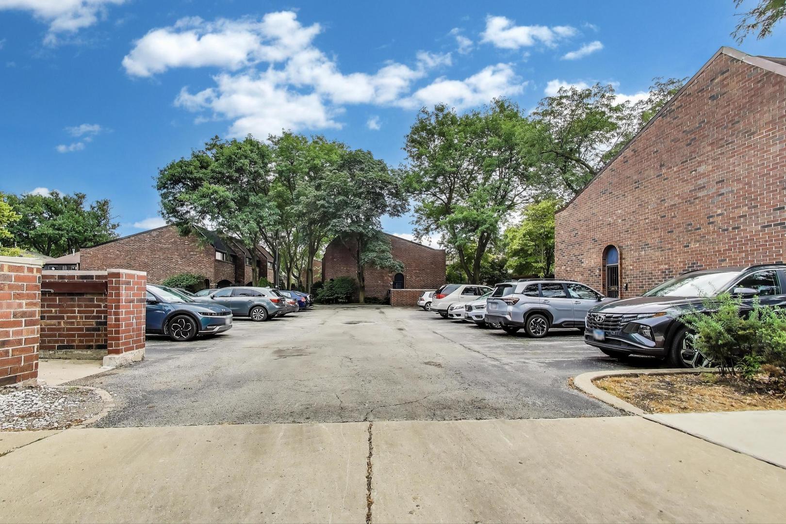821 South Racine Avenue, Unit D Chicago, IL 60607 - Photo 13 of 14 a view of a car parked in front of a house