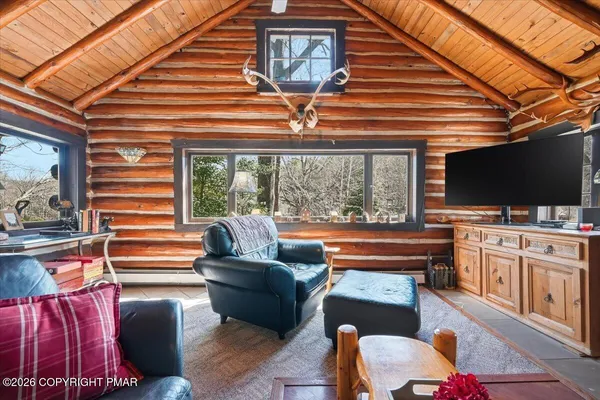 a view of livingroom with furniture and a flat screen tv