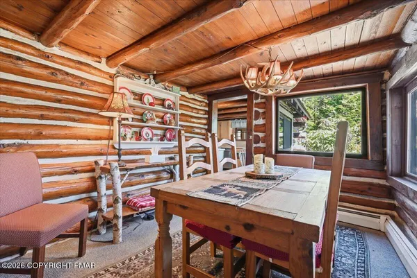a kitchen with stainless steel appliances granite countertop a stove a refrigerator and wooden floors