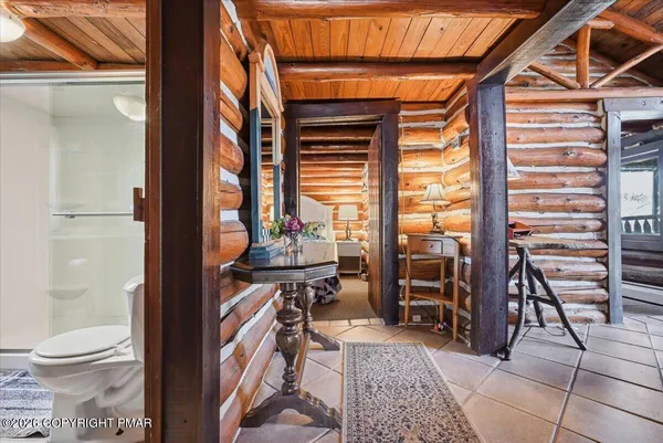 a bedroom with a bed and a mirror
