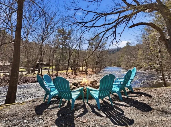 a view of a chairs and table in the patio