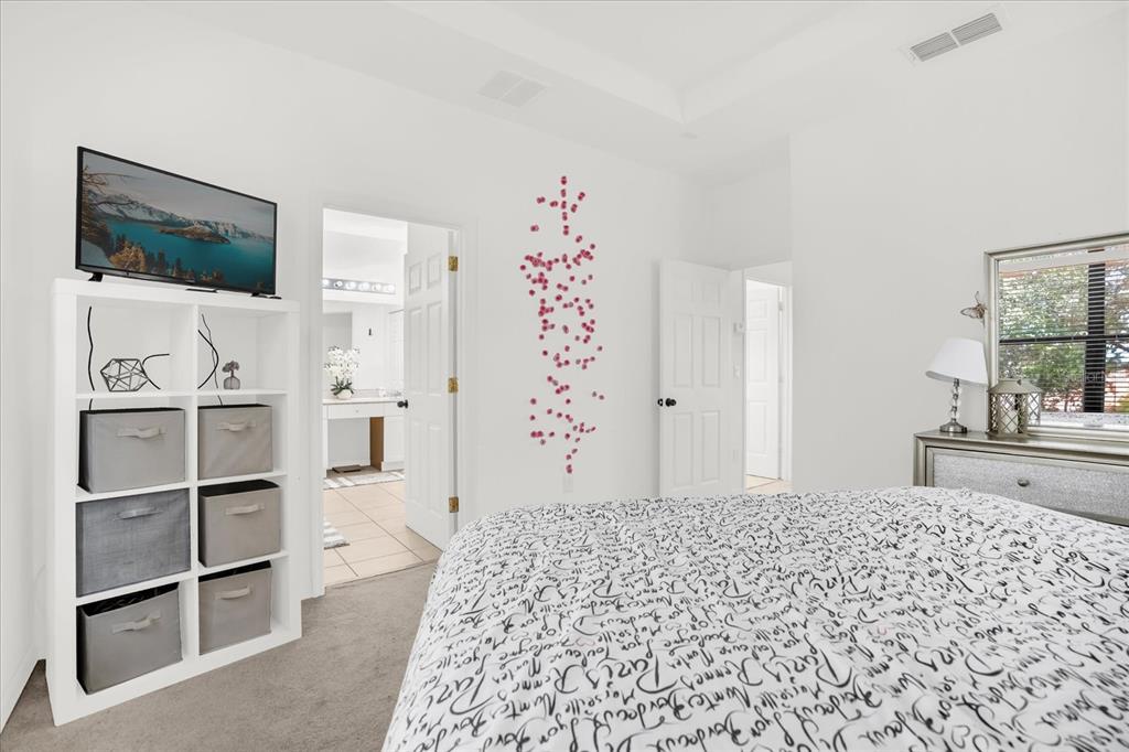 1374 Pacific Road Poinciana, FL 34759 - Photo 19 of 42 a bedroom with a bed and a window