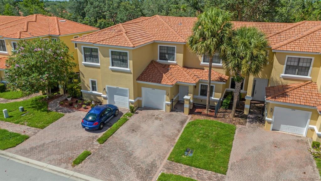 1374 Pacific Road Poinciana, FL 34759 - Photo 3 of 42 a front view of a house with garden