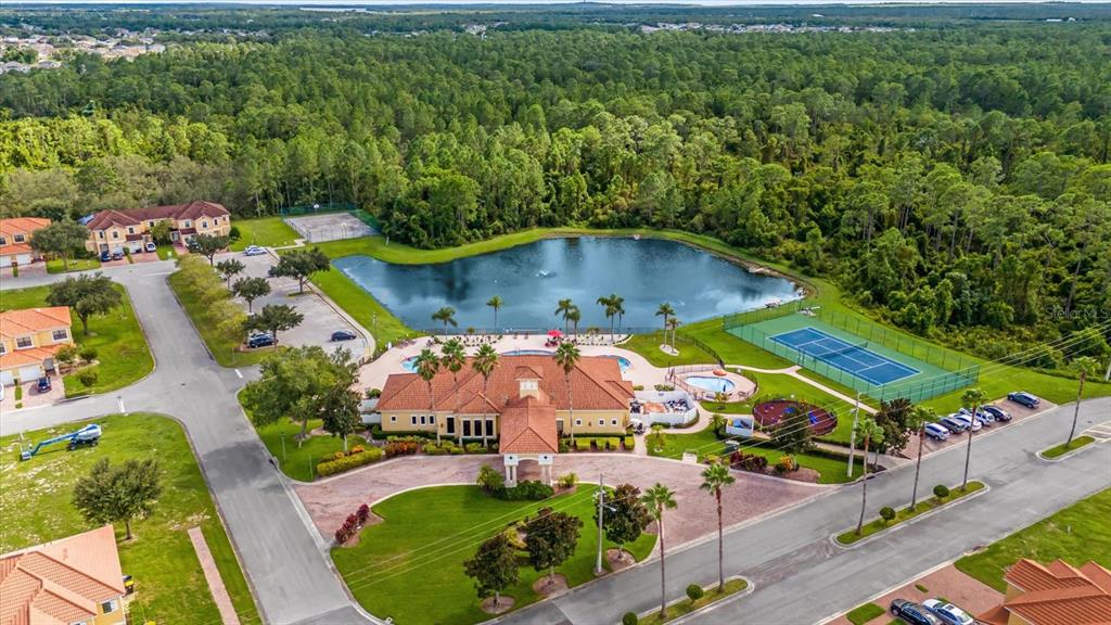 1374 Pacific Road Poinciana, FL 34759 - Photo 37 of 42 an aerial view of a house with a garden