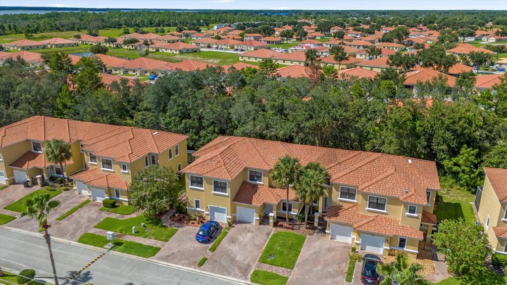 1374 Pacific Road Poinciana, FL 34759 - Photo 4 of 42 an aerial view of multiple houses with yard