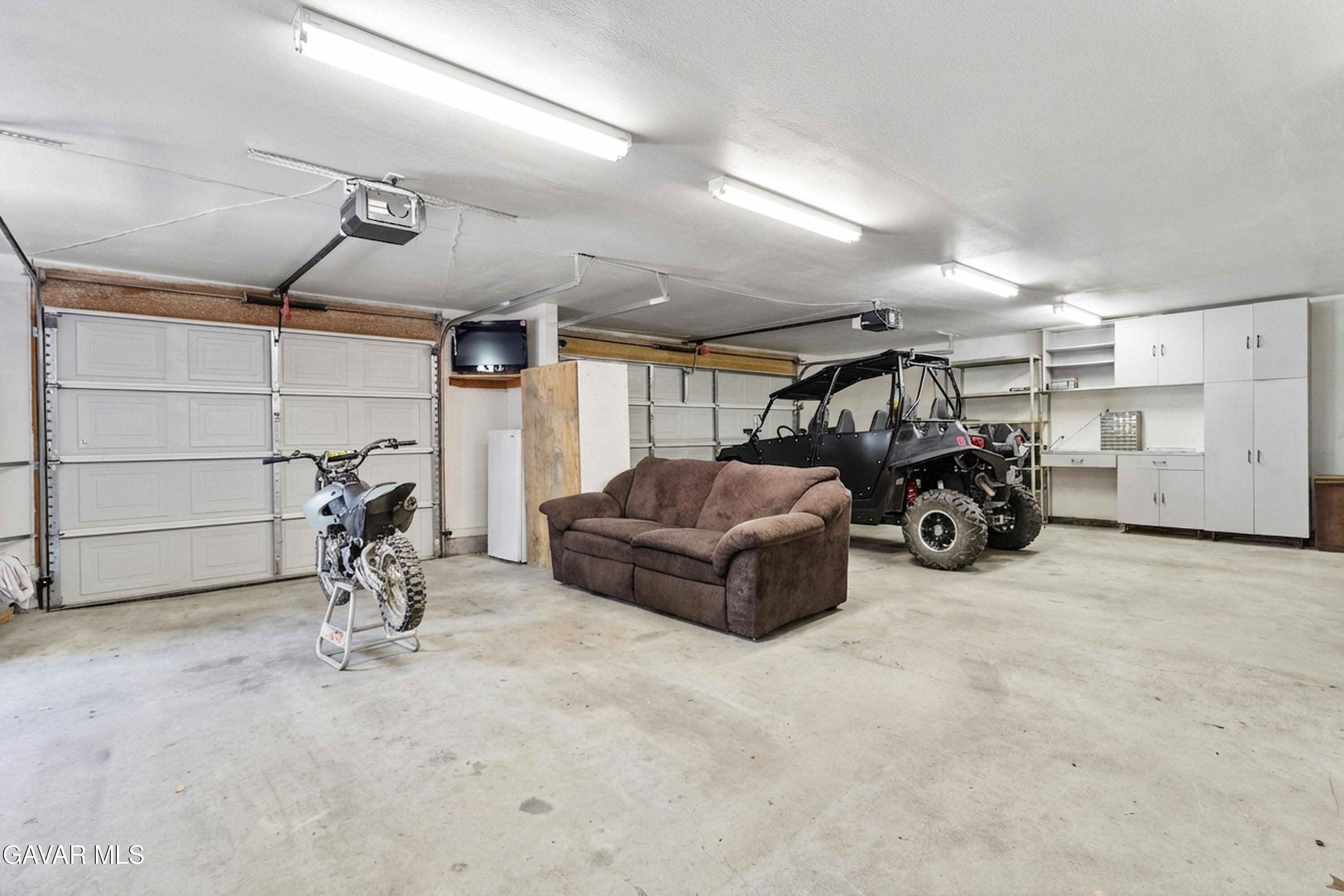 25631 High Rock Court Tehachapi, CA 93561 - Photo 18 of 31 a view of a garage with parked cars