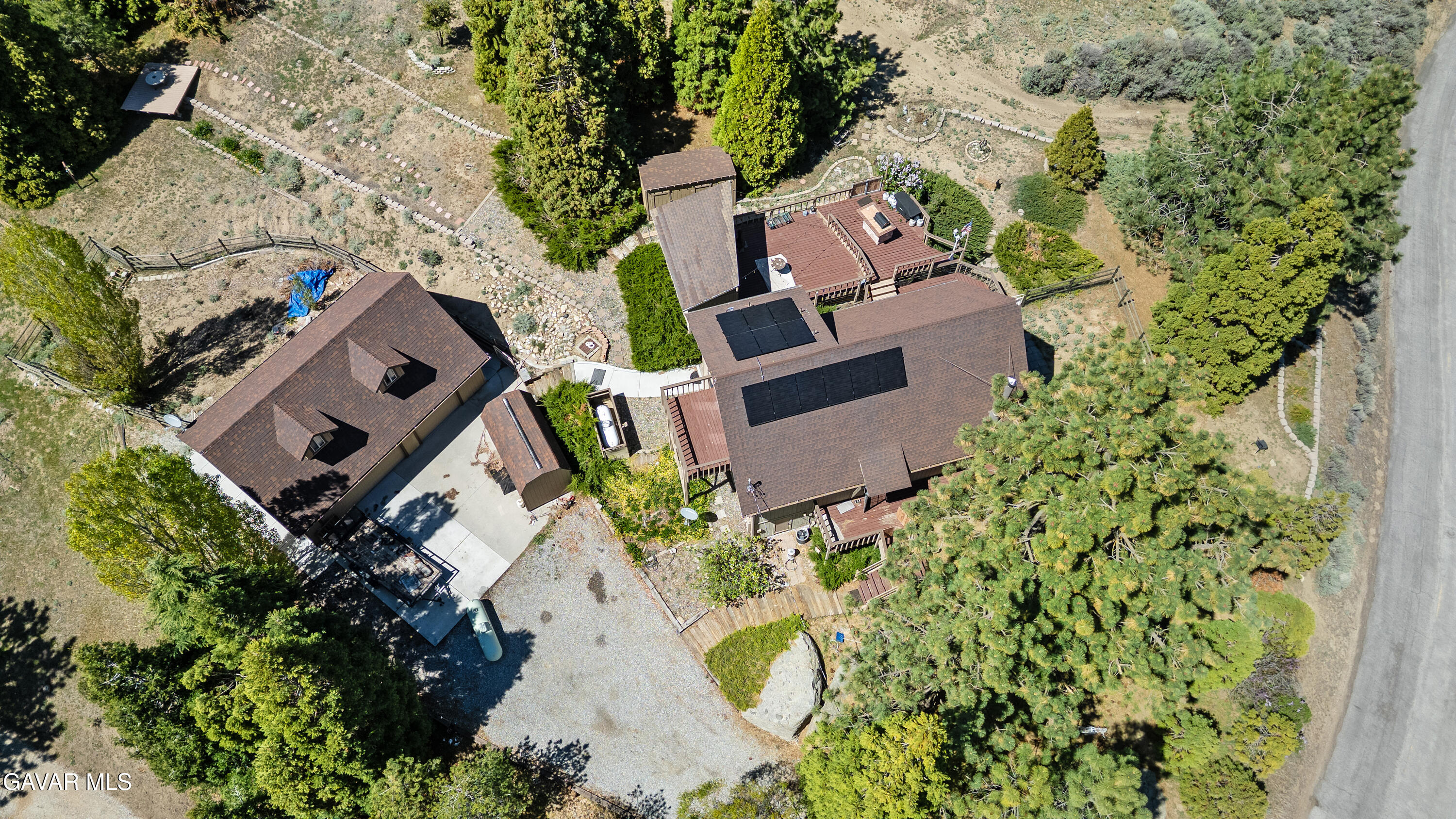 25631 High Rock Court Tehachapi, CA 93561 - Photo 23 of 31 an aerial view of a house with a yard and a large tree