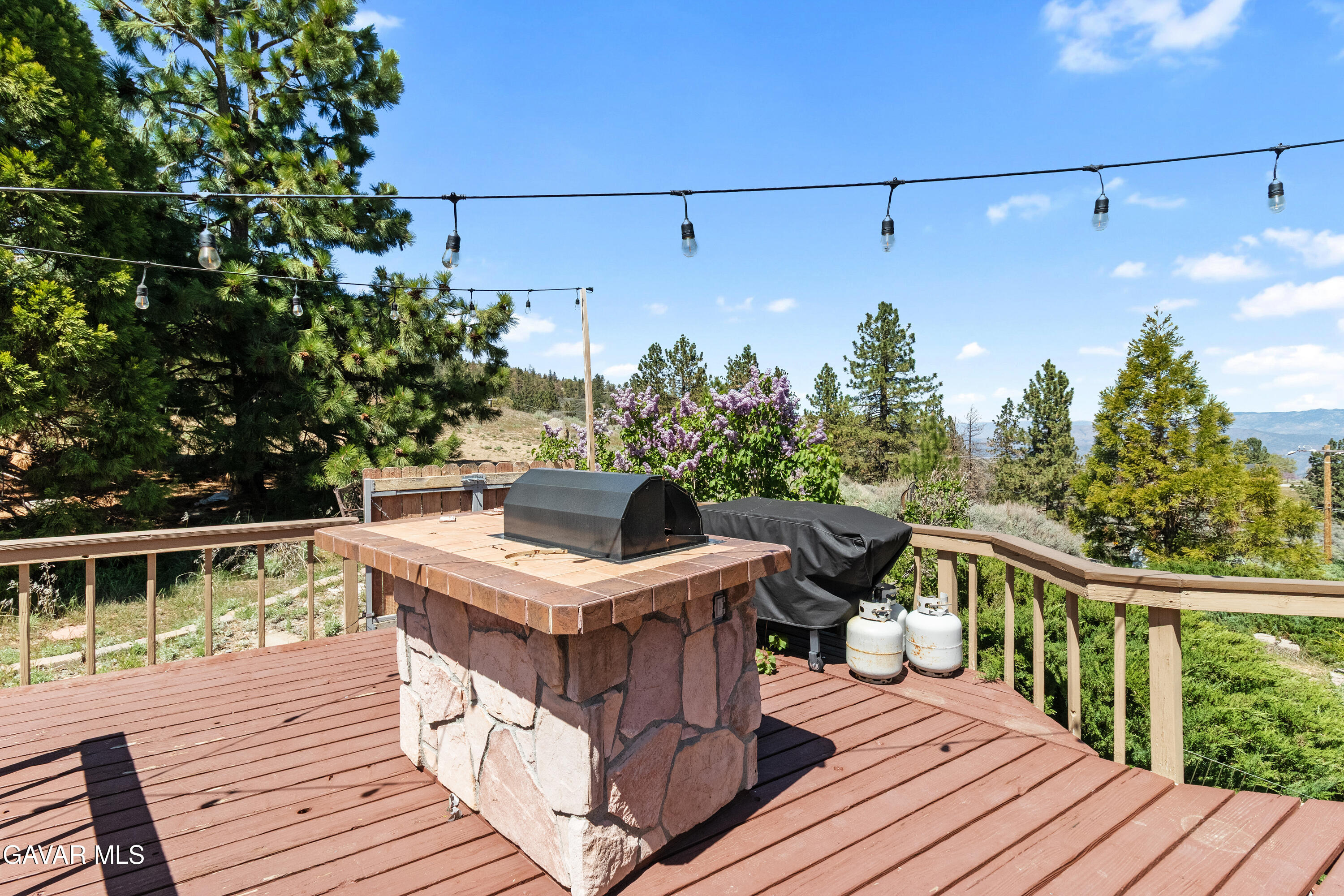 25631 High Rock Court Tehachapi, CA 93561 - Photo 28 of 31 a view of a balcony with wooden floor and outdoor seating