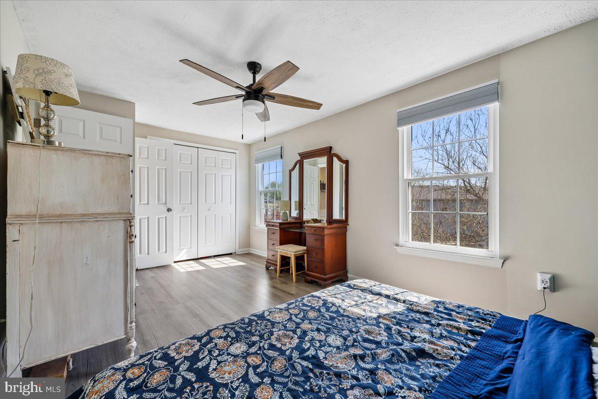 1476 Dockside Court Frederick, MD 21701 - Photo 16 of 34 a bedroom with a bed and wooden floor