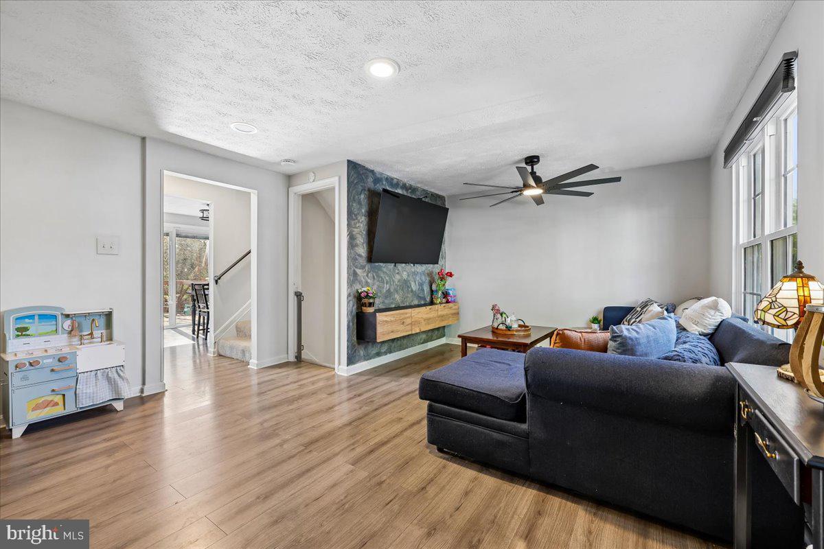 1476 Dockside Court Frederick, MD 21701 - Photo 2 of 34 a living room with furniture and a flat screen tv