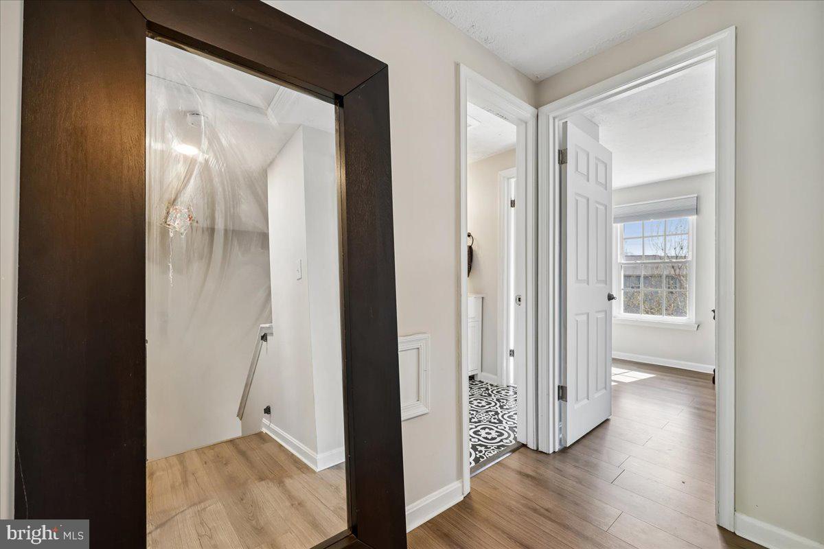 1476 Dockside Court Frederick, MD 21701 - Photo 22 of 34 a view of a hallway with wooden floor