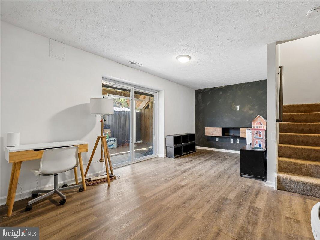 1476 Dockside Court Frederick, MD 21701 - Photo 23 of 34 a view of a livingroom with a flat screen tv and chairs