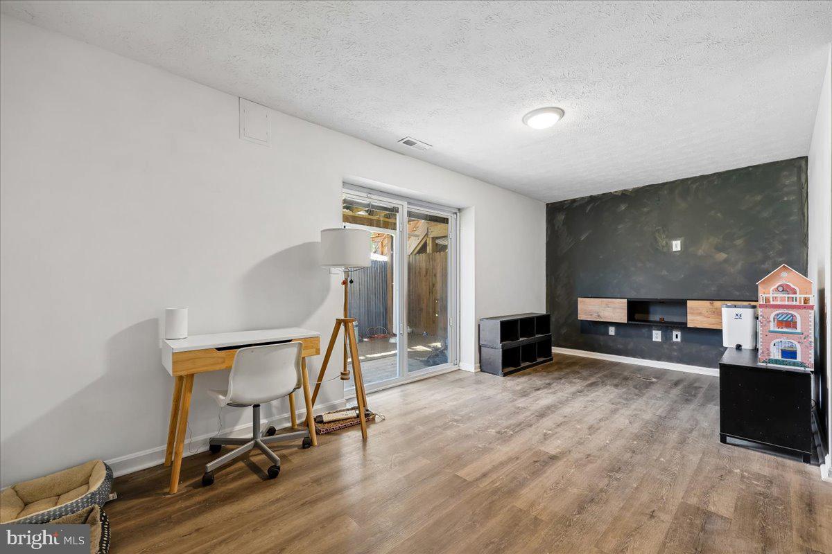 1476 Dockside Court Frederick, MD 21701 - Photo 24 of 34 a view of a livingroom with furniture and a flat screen tv