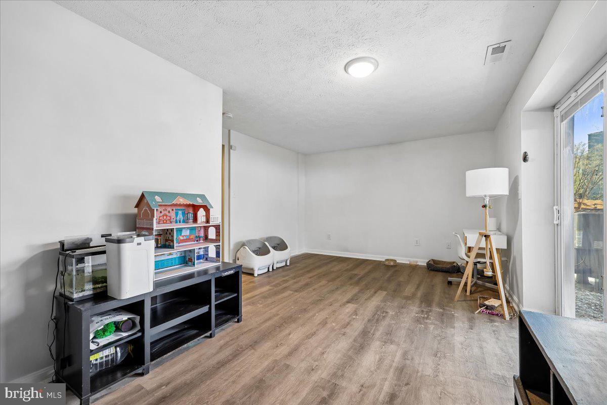 1476 Dockside Court Frederick, MD 21701 - Photo 25 of 34 a view of a workspace with furniture and wooden floor