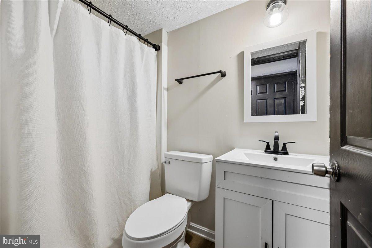 1476 Dockside Court Frederick, MD 21701 - Photo 27 of 34 a bathroom with a sink a toilet and shower