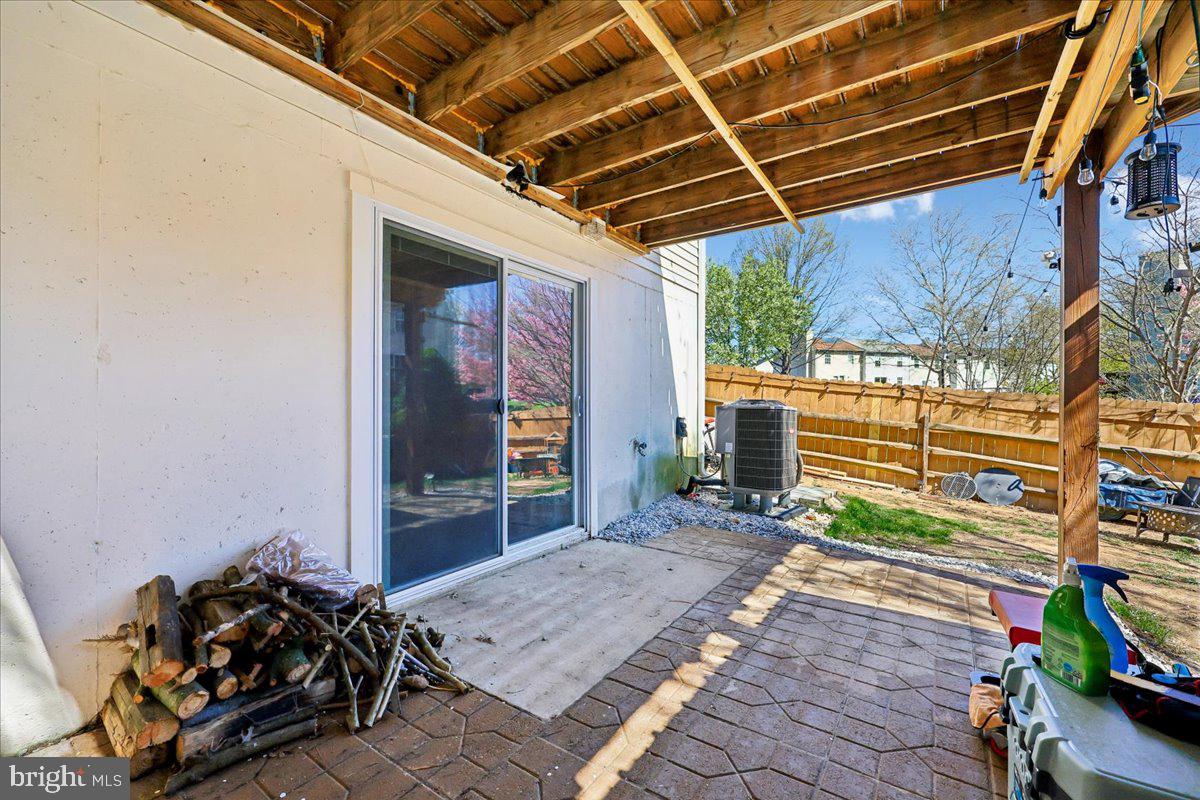 1476 Dockside Court Frederick, MD 21701 - Photo 30 of 34 a view of a patio with table and chairs and potted plants