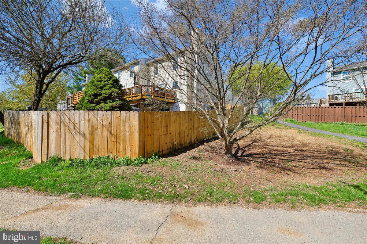 1476 Dockside Court Frederick, MD 21701 - Photo 31 of 34 a backyard of a house with lots of green space