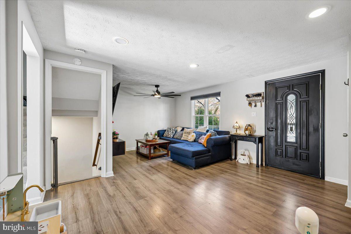 1476 Dockside Court Frederick, MD 21701 - Photo 8 of 34 a living room with furniture and a wooden floor