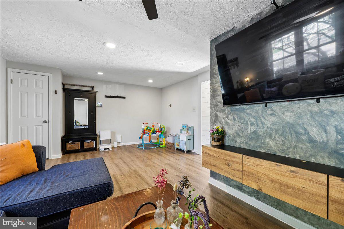 1476 Dockside Court Frederick, MD 21701 - Photo 9 of 34 a living room with furniture and a floor to ceiling window