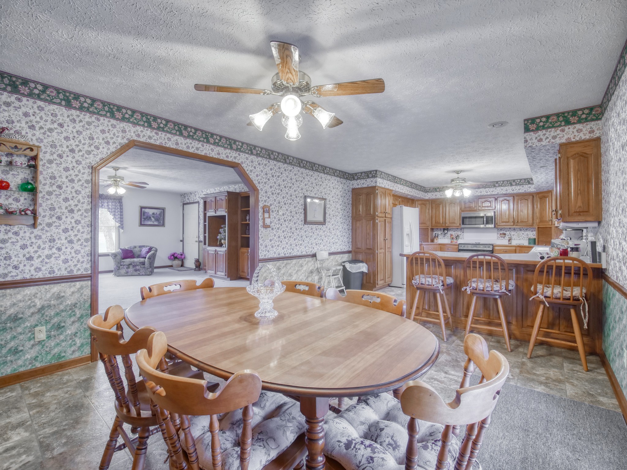 5149 Beech Log Road Lebanon, TN 37090 - Photo 18 of 44 a view of a dining room with furniture and wooden floor