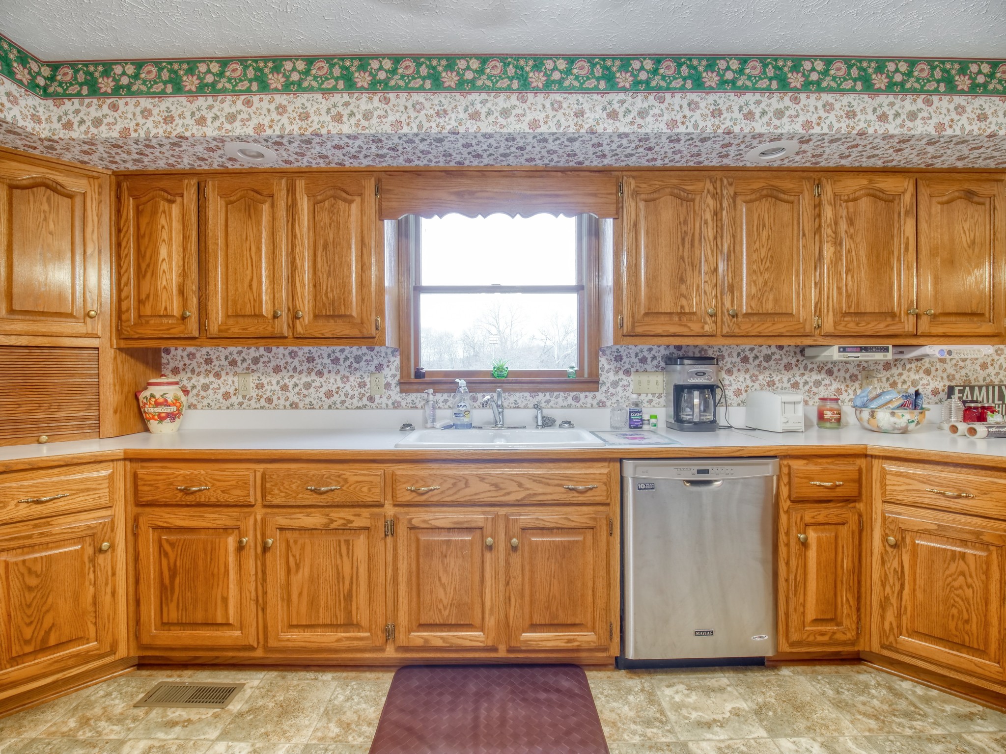 5149 Beech Log Road Lebanon, TN 37090 - Photo 23 of 44 a kitchen with stainless steel appliances granite countertop a sink a stove and a microwave