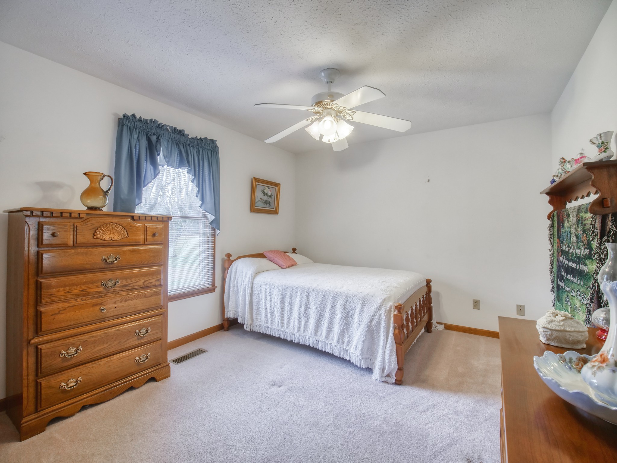 5149 Beech Log Road Lebanon, TN 37090 - Photo 27 of 44 a bedroom with a bed and ceiling fan