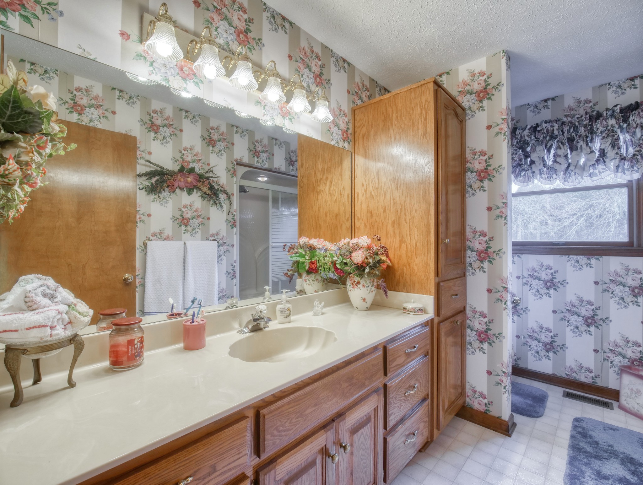 5149 Beech Log Road Lebanon, TN 37090 - Photo 32 of 44 a bathroom with a sink and a mirror
