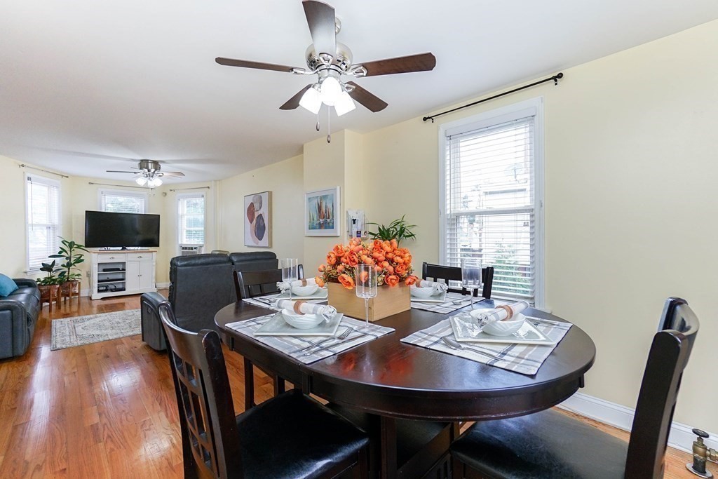 291 Carter Street Chelsea, MA 02150 - Photo 13 of 40 a view of a dining room with furniture window and wooden floor