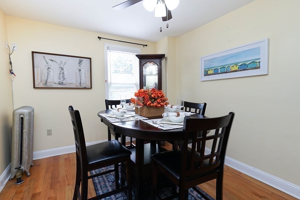 291 Carter Street Chelsea, MA 02150 - Photo 14 of 40 a view of a dining room with furniture and wooden floor
