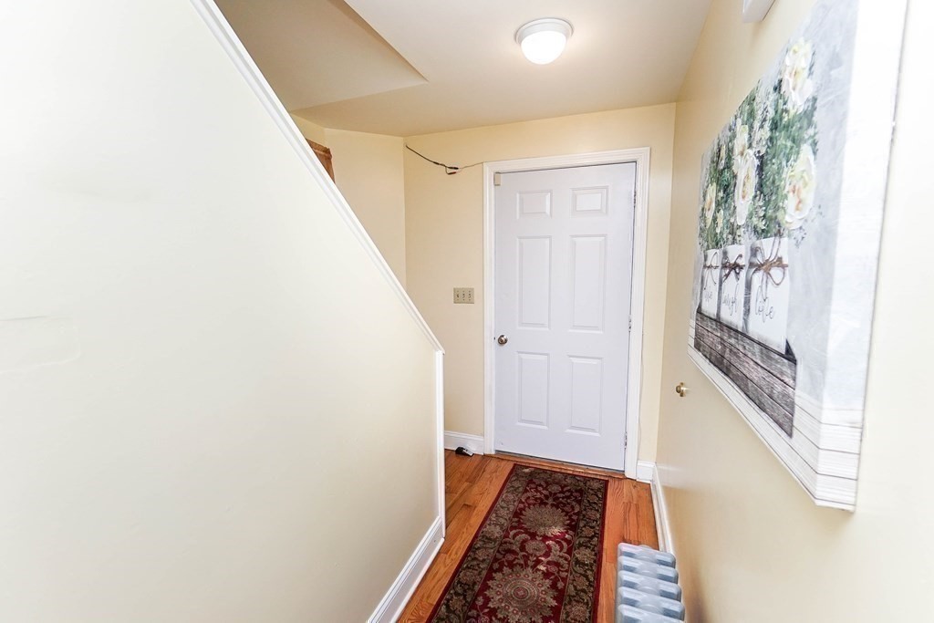 291 Carter Street Chelsea, MA 02150 - Photo 19 of 40 a view of stairs with wooden floor