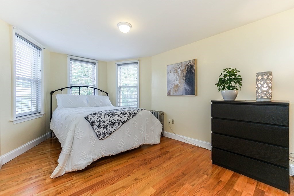 291 Carter Street Chelsea, MA 02150 - Photo 20 of 40 a bedroom with a bed and a window