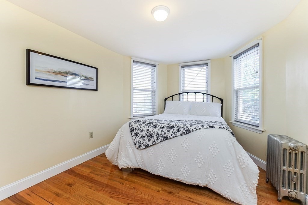 291 Carter Street Chelsea, MA 02150 - Photo 21 of 40 a bedroom with a bed and a window
