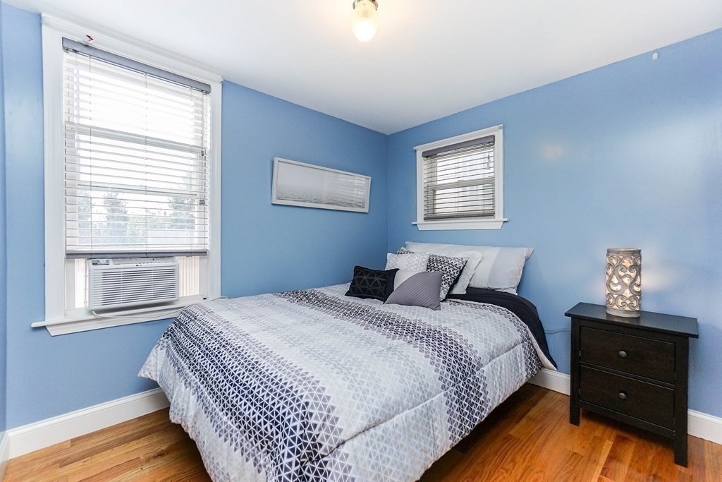 291 Carter Street Chelsea, MA 02150 - Photo 24 of 40 a bedroom with a bed and a window